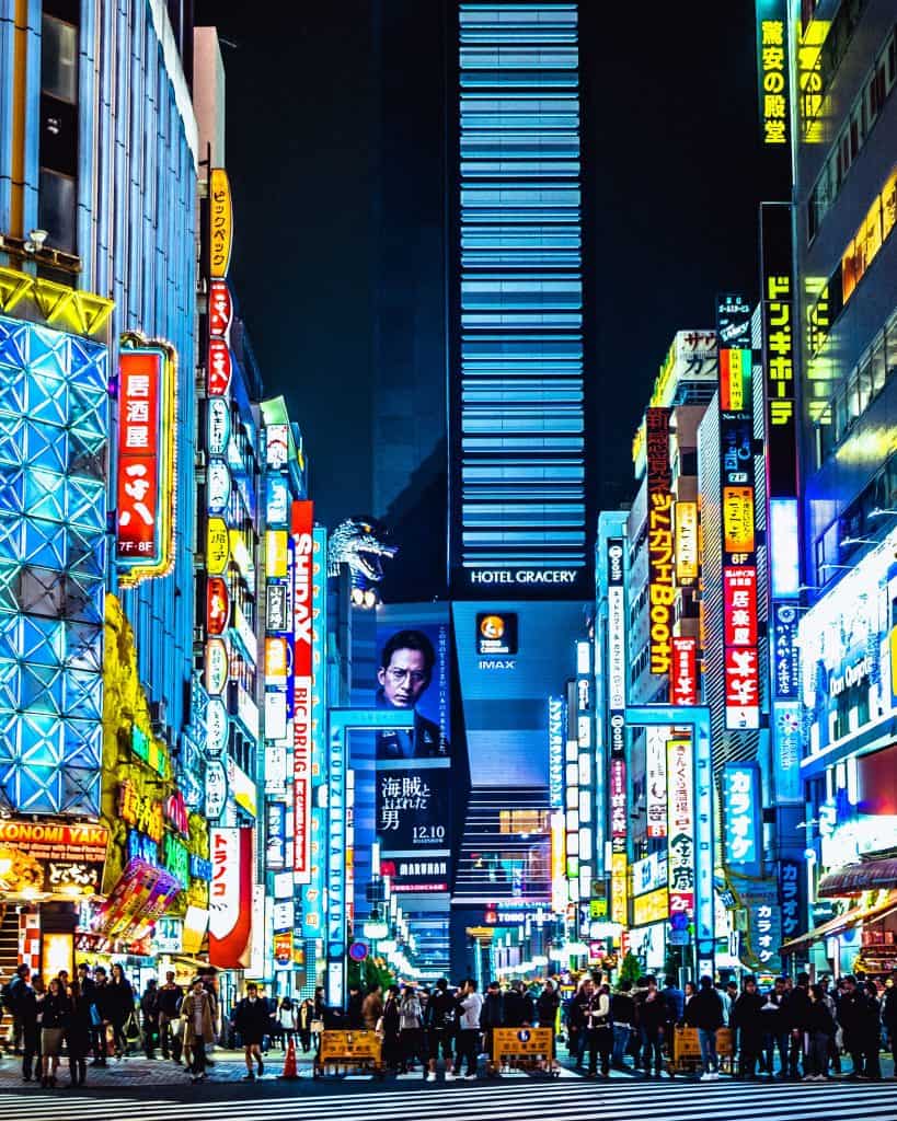 Shibuya in Tokyo Japan lit up with lights from the billboards and shops.